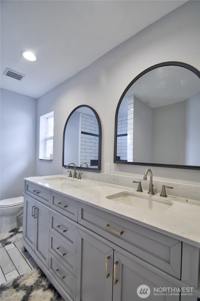 53 E Elma Mccleary Rd, Elma, WA 98514 - full bathroom with double vanity and marble look tile flooring