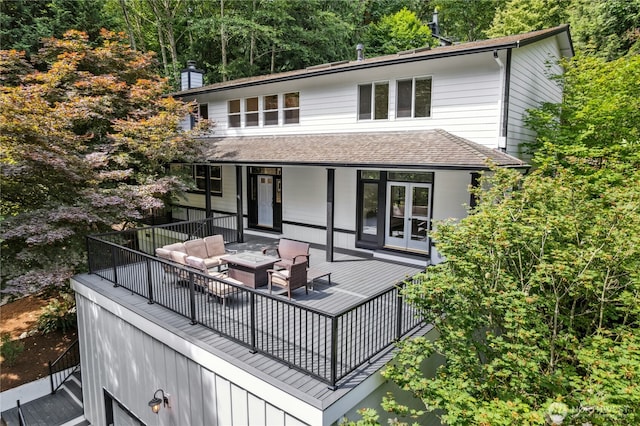 17519 33rd Ave NE, Lake Forest Park, WA 98155 - back of house featuring an outdoor living space with a fire pit, a shingled roof, a chimney, a deck, and french doors