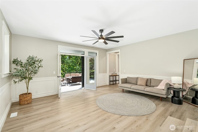 17519 33rd Ave NE, Lake Forest Park, WA 98155 - living area with wood finished floors, wainscoting, ceiling fan, and a decorative wall