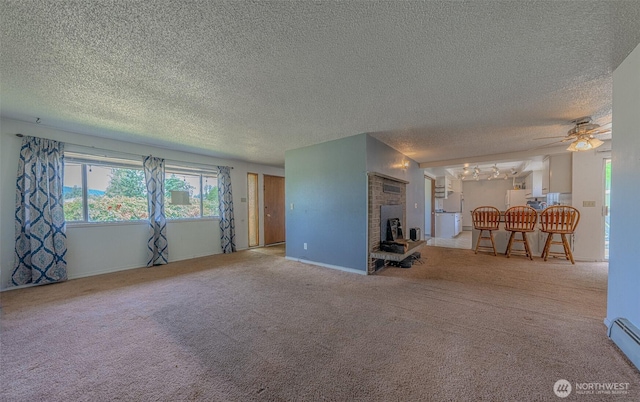 5735 NE 8th St, Renton, WA 98059 - unfurnished living room with a textured ceiling, ceiling fan, carpet flooring, and plenty of natural light