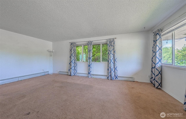 5735 NE 8th St, Renton, WA 98059 - empty room with healthy amount of natural light, a baseboard radiator, a textured ceiling, and carpet flooring