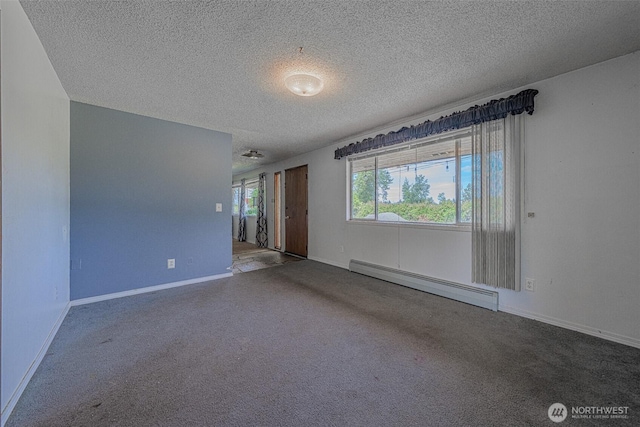 5735 NE 8th St, Renton, WA 98059 - carpeted empty room with a baseboard radiator and a textured ceiling