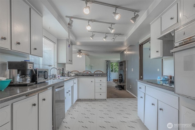 5735 NE 8th St, Renton, WA 98059 - kitchen featuring dishwasher, a peninsula, electric cooktop, light floors, and white cabinets