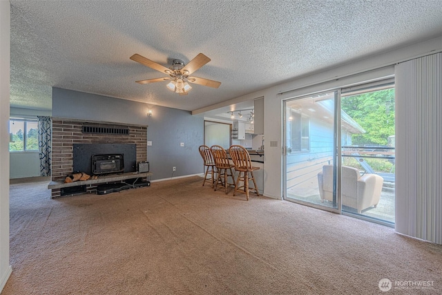 5735 NE 8th St, Renton, WA 98059 - living room featuring carpet floors, a textured ceiling, and ceiling fan