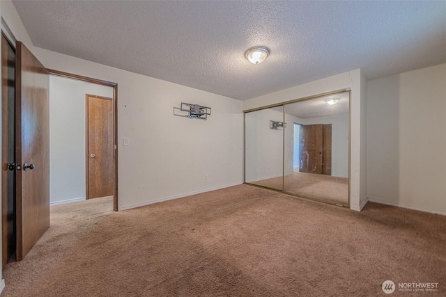5735 NE 8th St, Renton, WA 98059 - unfurnished bedroom with carpet, a textured ceiling, and a closet