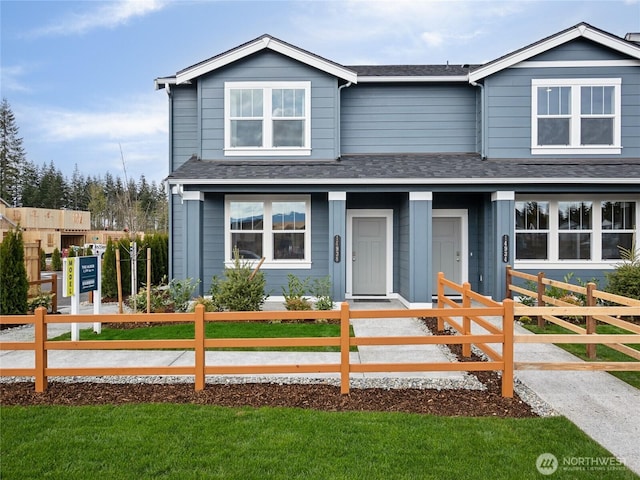 14829 203rd Avenue Ct E Unit 648, Bonney Lake, WA 98391 - view of front of home featuring a fenced front yard and a shingled roof