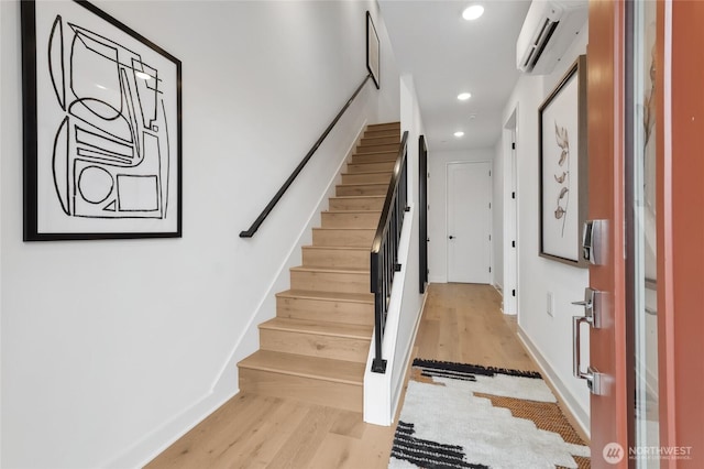 12207 137th Pl NE Unit 2602, Redmond, WA 98052 - stairway with a wall unit AC, wood finished floors, and recessed lighting