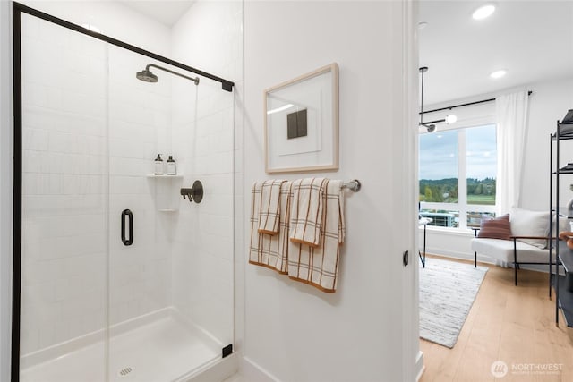 12207 137th Pl NE Unit 2602, Redmond, WA 98052 - bathroom with a stall shower, recessed lighting, and wood finished floors