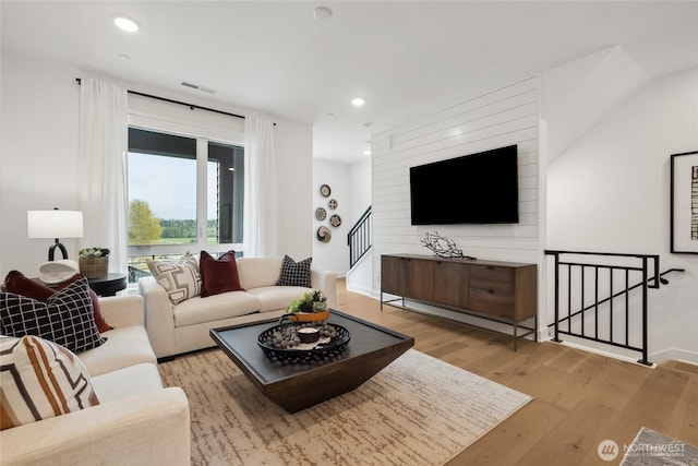 12207 137th Pl NE Unit 2602, Redmond, WA 98052 - living room with wood finished floors, stairs, and recessed lighting