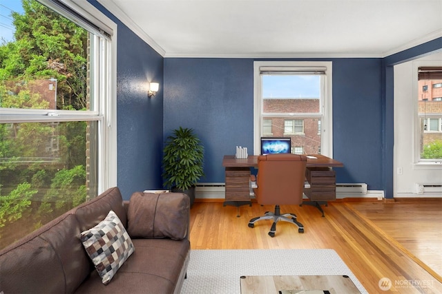 404 E Harrison St Unit 301, Seattle, WA 98102 - home office with a baseboard heating unit, wood finished floors, and ornamental molding