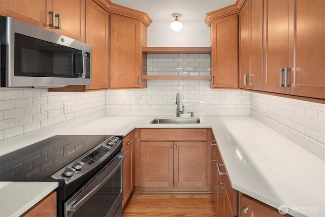 404 E Harrison St Unit 301, Seattle, WA 98102 - kitchen with appliances with stainless steel finishes, backsplash, open shelves, brown cabinetry, and light countertops