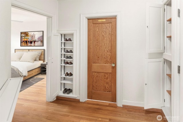 404 E Harrison St Unit 301, Seattle, WA 98102 - hall with light wood-style floors and baseboards