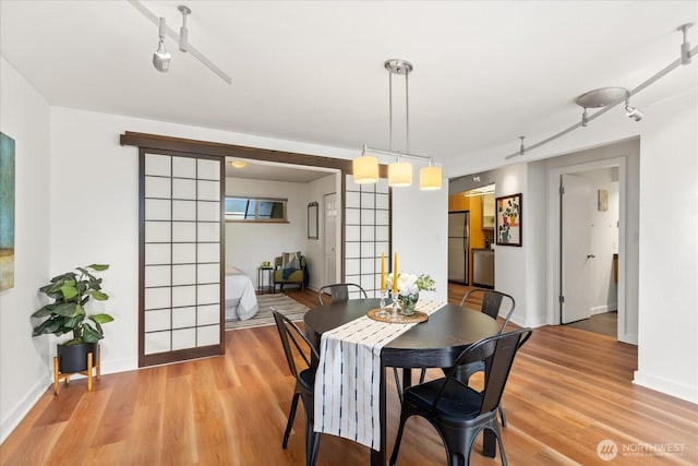 732 11th Ave E Unit 404, Seattle, WA 98102 - dining room with light wood-style flooring
