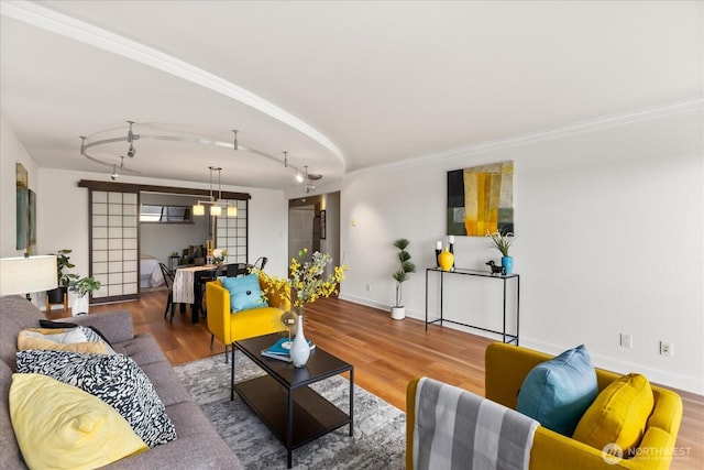 732 11th Ave E Unit 404, Seattle, WA 98102 - living area featuring wood finished floors and rail lighting