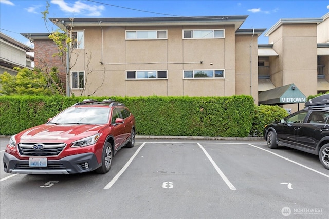 732 11th Ave E Unit 404, Seattle, WA 98102 - view of building exterior featuring uncovered parking