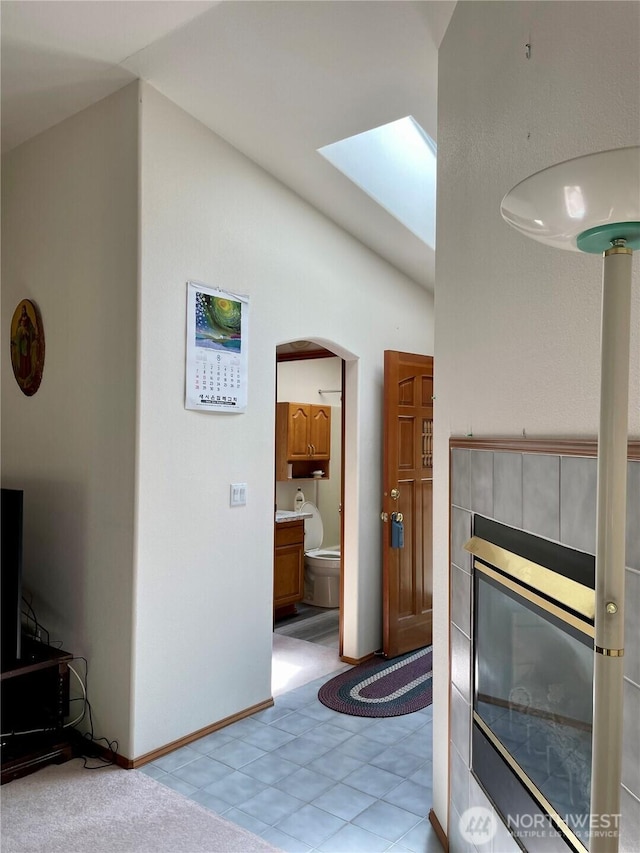 9238 Classic Dr NE, Lacey, WA 98516 - living room featuring a skylight, arched walkways, and lofted ceiling
