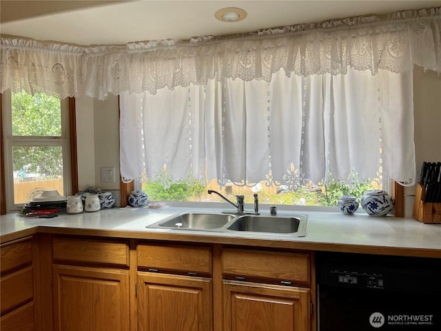 9238 Classic Dr NE, Lacey, WA 98516 - kitchen featuring black dishwasher, light countertops, and brown cabinetry
