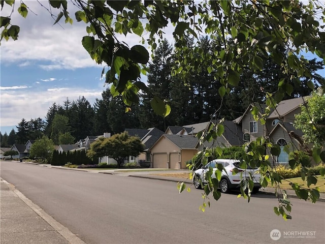 9238 Classic Dr NE, Lacey, WA 98516 - view of asphalt street with sidewalks, a residential view, and curbs