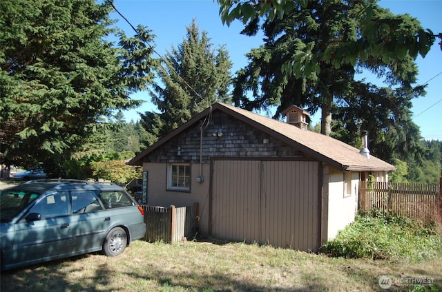 3295 Hastings Ave, Port Townsend, WA 98368 - view of property exterior featuring a chimney and an outbuilding