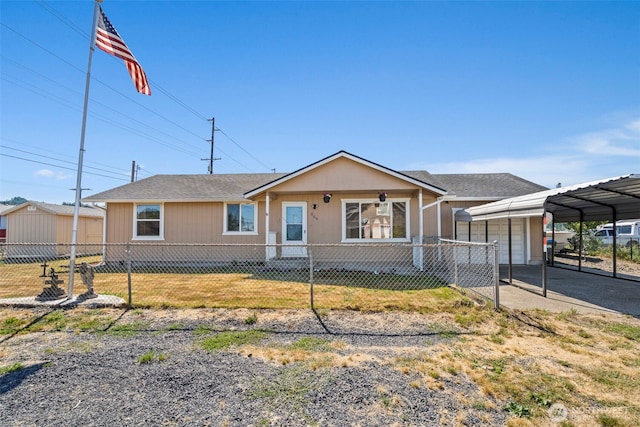 309 SW 6th St, Chehalis, WA 98532 - view of front of home featuring a fenced front yard, an attached garage, and a carport