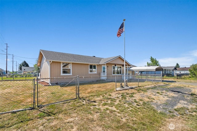 309 SW 6th St, Chehalis, WA 98532 - back of house featuring a detached carport and a gate
