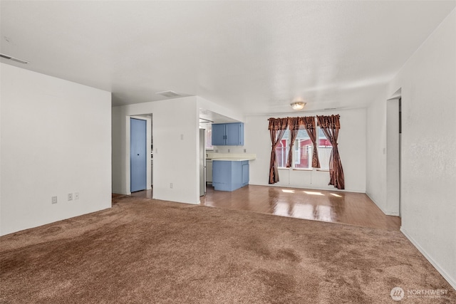 309 SW 6th St, Chehalis, WA 98532 - unfurnished living room featuring light carpet
