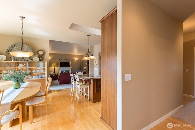 1901 W Hamilton Way, Port Angeles, WA 98363 - dining space featuring light wood finished floors and a fireplace