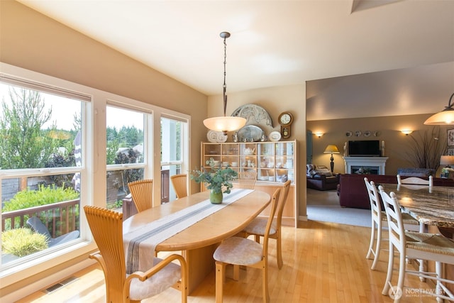 1901 W Hamilton Way, Port Angeles, WA 98363 - dining space with light wood-style floors and a fireplace