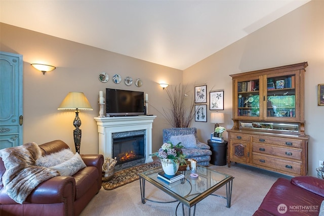 1901 W Hamilton Way, Port Angeles, WA 98363 - living room featuring carpet floors, vaulted ceiling, and a glass covered fireplace