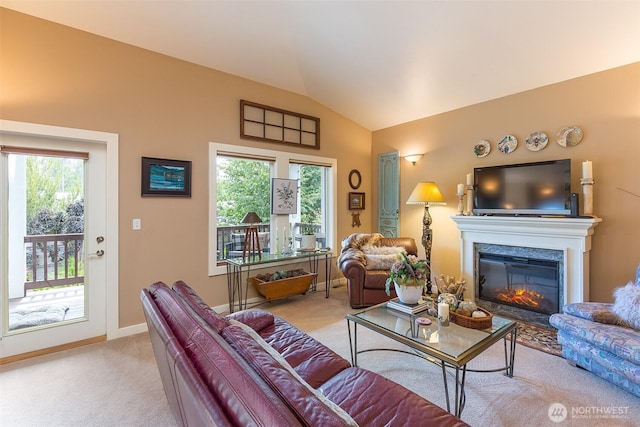 1901 W Hamilton Way, Port Angeles, WA 98363 - living area with carpet floors, vaulted ceiling, a glass covered fireplace, and plenty of natural light