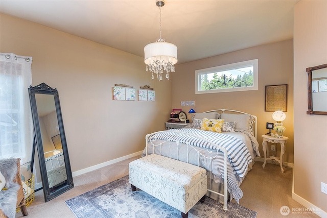 1901 W Hamilton Way, Port Angeles, WA 98363 - carpeted bedroom with baseboards and a chandelier