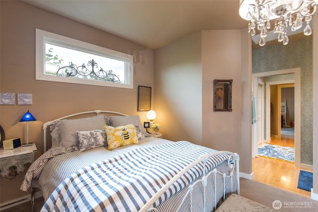 1901 W Hamilton Way, Port Angeles, WA 98363 - bedroom with a chandelier and wood finished floors