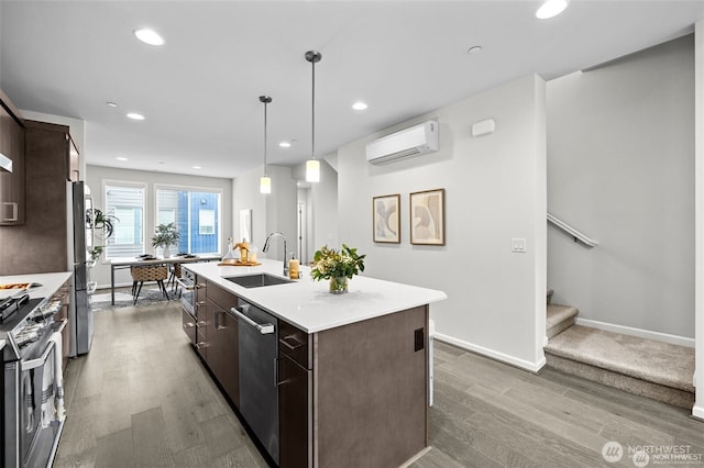 7629 NE 122nd Ct Unit 7, Kirkland, WA 98034 - kitchen featuring a wall mounted air conditioner, wood finished floors, appliances with stainless steel finishes, dark brown cabinets, and recessed lighting