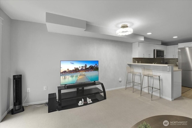 425 Vine St Unit 614, Seattle, WA 98121 - living area featuring light carpet and recessed lighting