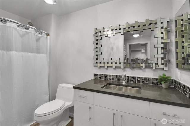 425 Vine St Unit 614, Seattle, WA 98121 - bathroom with vanity, a shower with curtain, and decorative backsplash