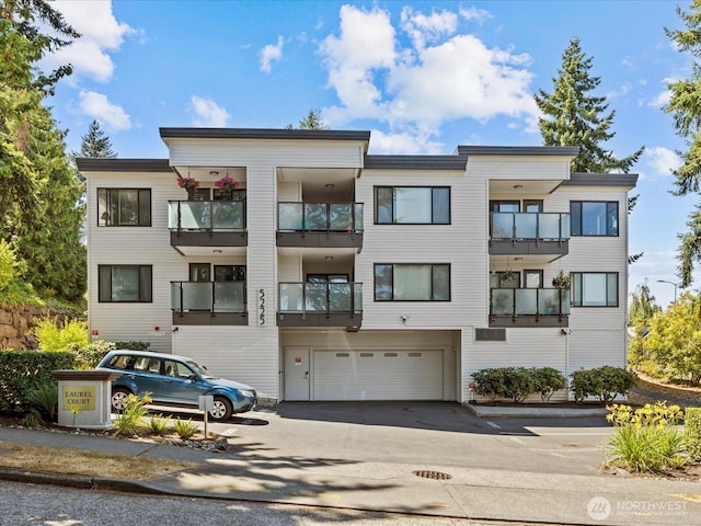 5225 50th Ave NE Unit 103, Seattle, WA 98105 - view of property with an attached garage and driveway