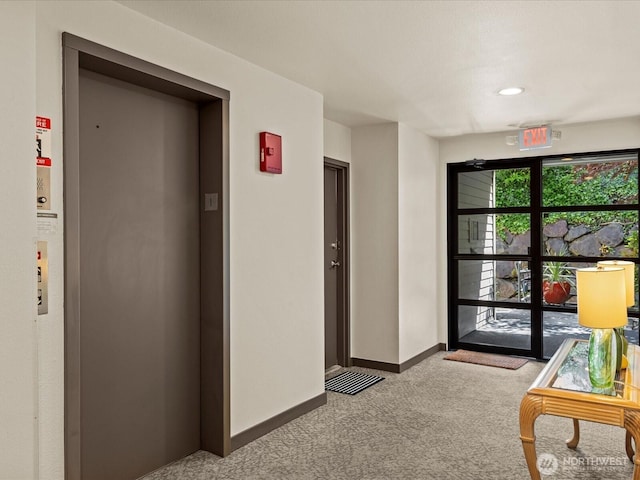 5225 50th Ave NE Unit 103, Seattle, WA 98105 - hall with elevator and carpet flooring