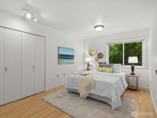 5225 50th Ave NE Unit 103, Seattle, WA 98105 - bedroom with light wood finished floors and baseboards