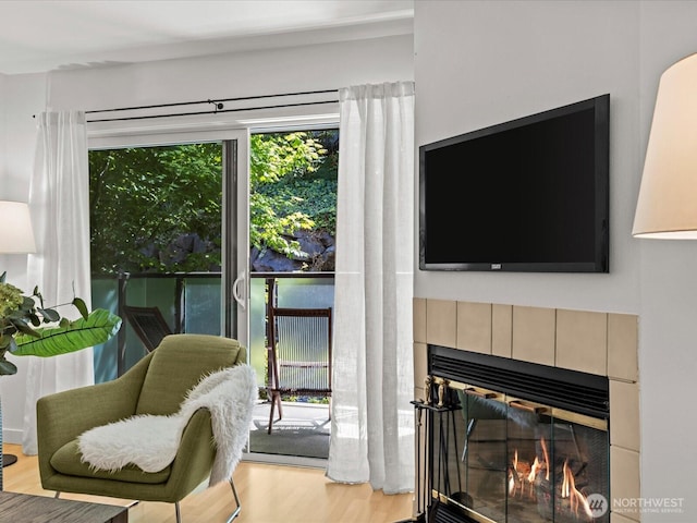 5225 50th Ave NE Unit 103, Seattle, WA 98105 - living room featuring a fireplace and wood finished floors
