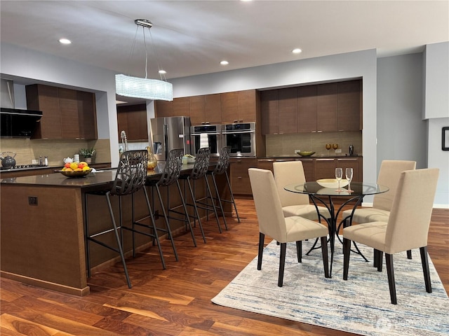 16486 SE 46th Ct, Bellevue, WA 98006 - dining space with dark wood-style flooring and recessed lighting