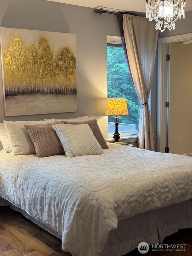 16486 SE 46th Ct, Bellevue, WA 98006 - bedroom featuring wood finished floors and a chandelier
