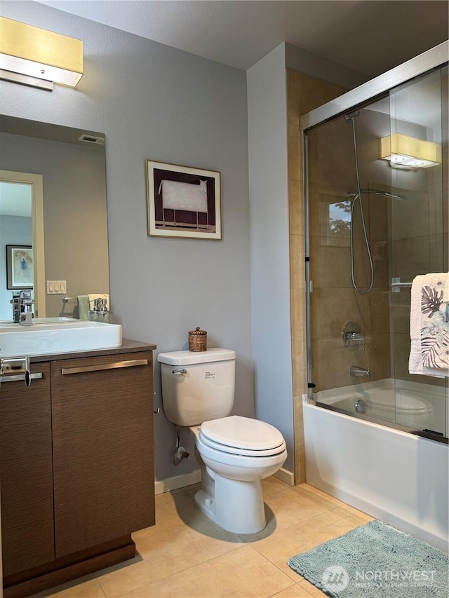 16486 SE 46th Ct, Bellevue, WA 98006 - full bathroom featuring vanity, tile patterned flooring, and bath / shower combo with glass door
