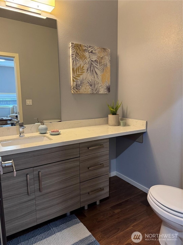 16486 SE 46th Ct, Bellevue, WA 98006 - half bathroom featuring vanity and wood finished floors