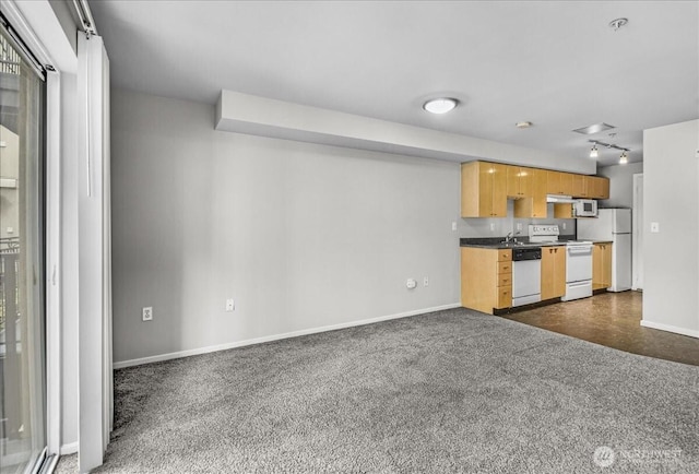 425 Vine St Unit 421, Seattle, WA 98121 - unfurnished living room with baseboards and dark carpet
