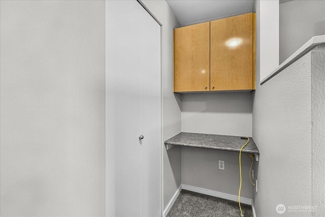 425 Vine St Unit 421, Seattle, WA 98121 - washroom featuring baseboards and dark colored carpet