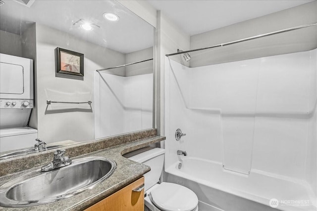 425 Vine St Unit 421, Seattle, WA 98121 - full bathroom with estacked washer and dryer, shower / tub combination, and vanity