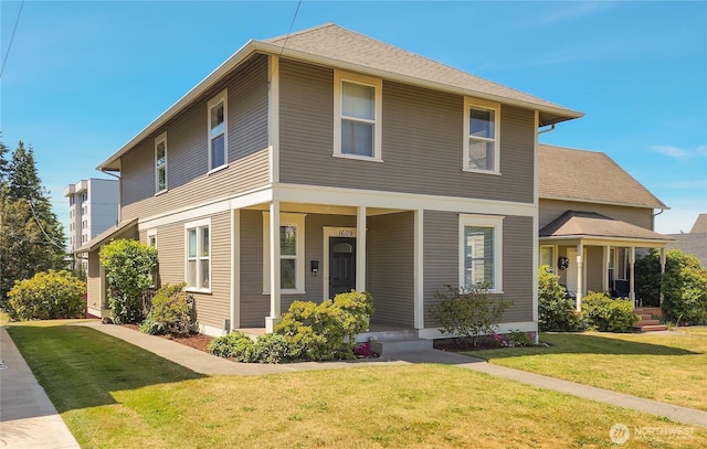 1609 Humboldt St, Bellingham, WA 98225 - view of front of house featuring a porch and a front yard