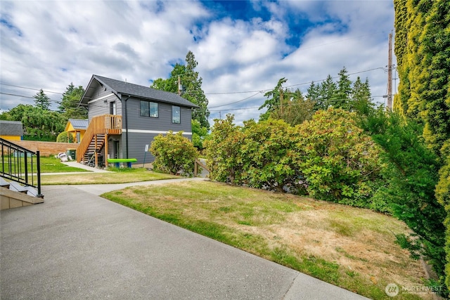 1609 Humboldt St, Bellingham, WA 98225 - view of grassy yard featuring stairs and a deck