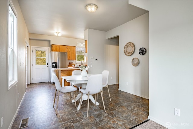 1609 Humboldt St, Bellingham, WA 98225 - dining room with dark stone finish flooring and baseboards