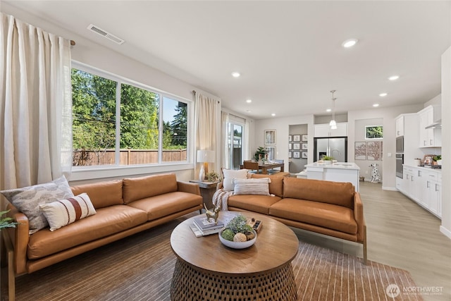 26808 NE 143rd Cir Unit 25, Duvall, WA 98019 - living area with recessed lighting and light wood finished floors